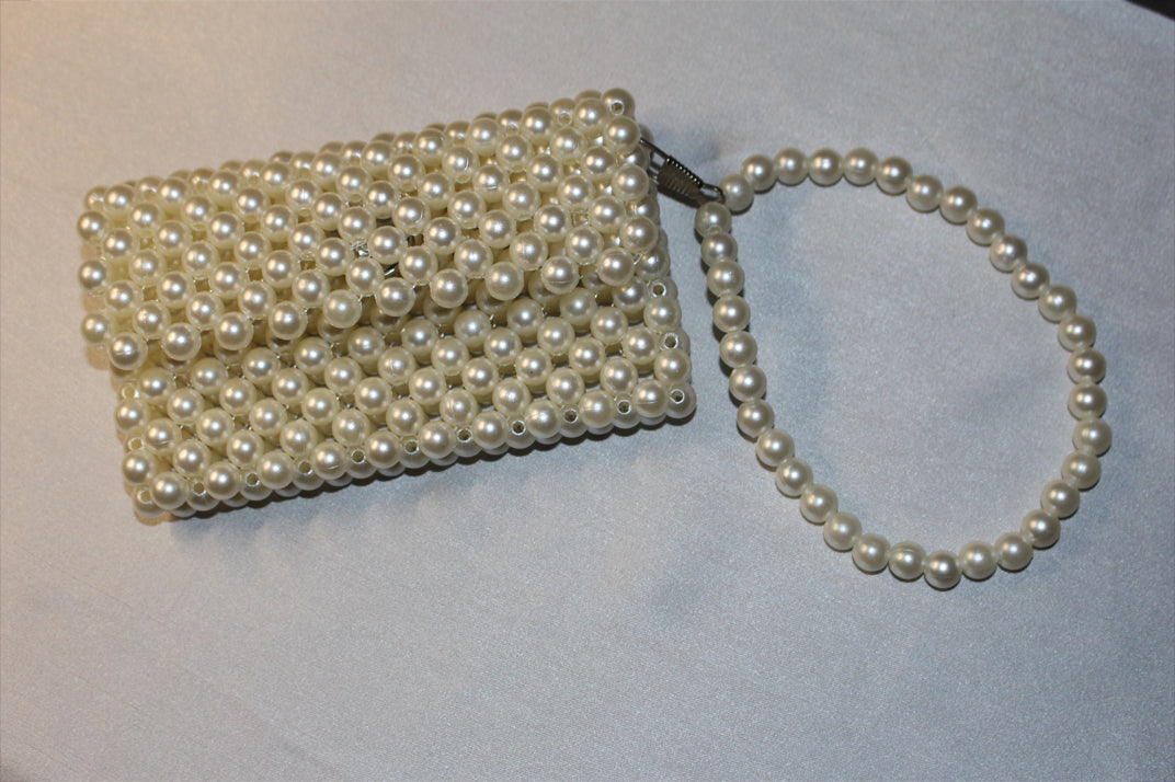 Handcrafted beaded purse with intricate design and elegant finish—perfect for formal events and everyday elegance.
