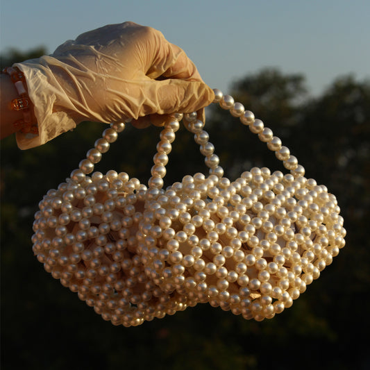 Handcrafted pearl beaded handbag with a chic, elegant design—perfect for special occasions and stylish outfits.