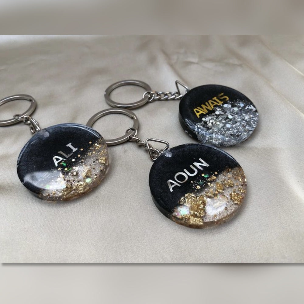 Handcrafted personalized resin name keychains with vibrant colors and stylish finishes—perfect for gifting or daily use.